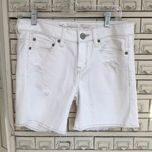 Distressed white stretch shorts
